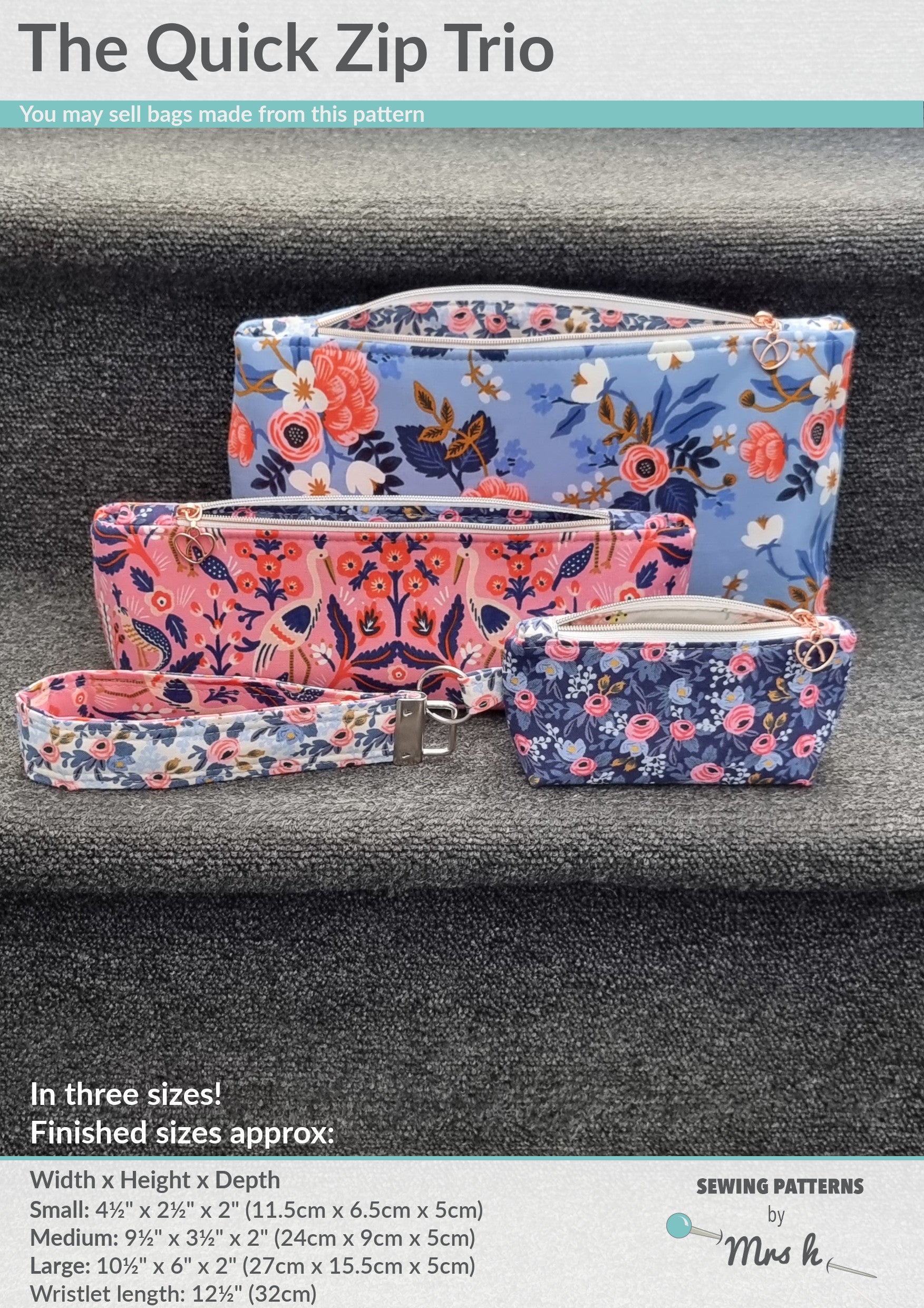 Floral patterned bags including a pouch, wallet, and wristlet on a gray background.
