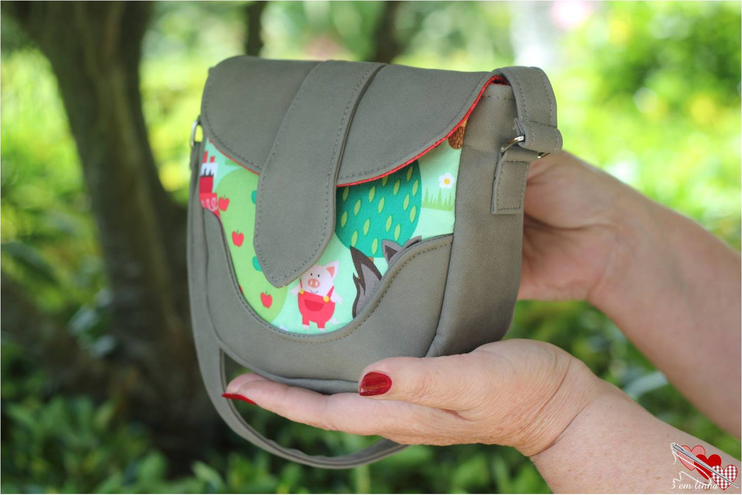 Dollie Mini Crossbody Sewing Pattern made by MMaria Luisa Santos Red hiding hood fabric side view