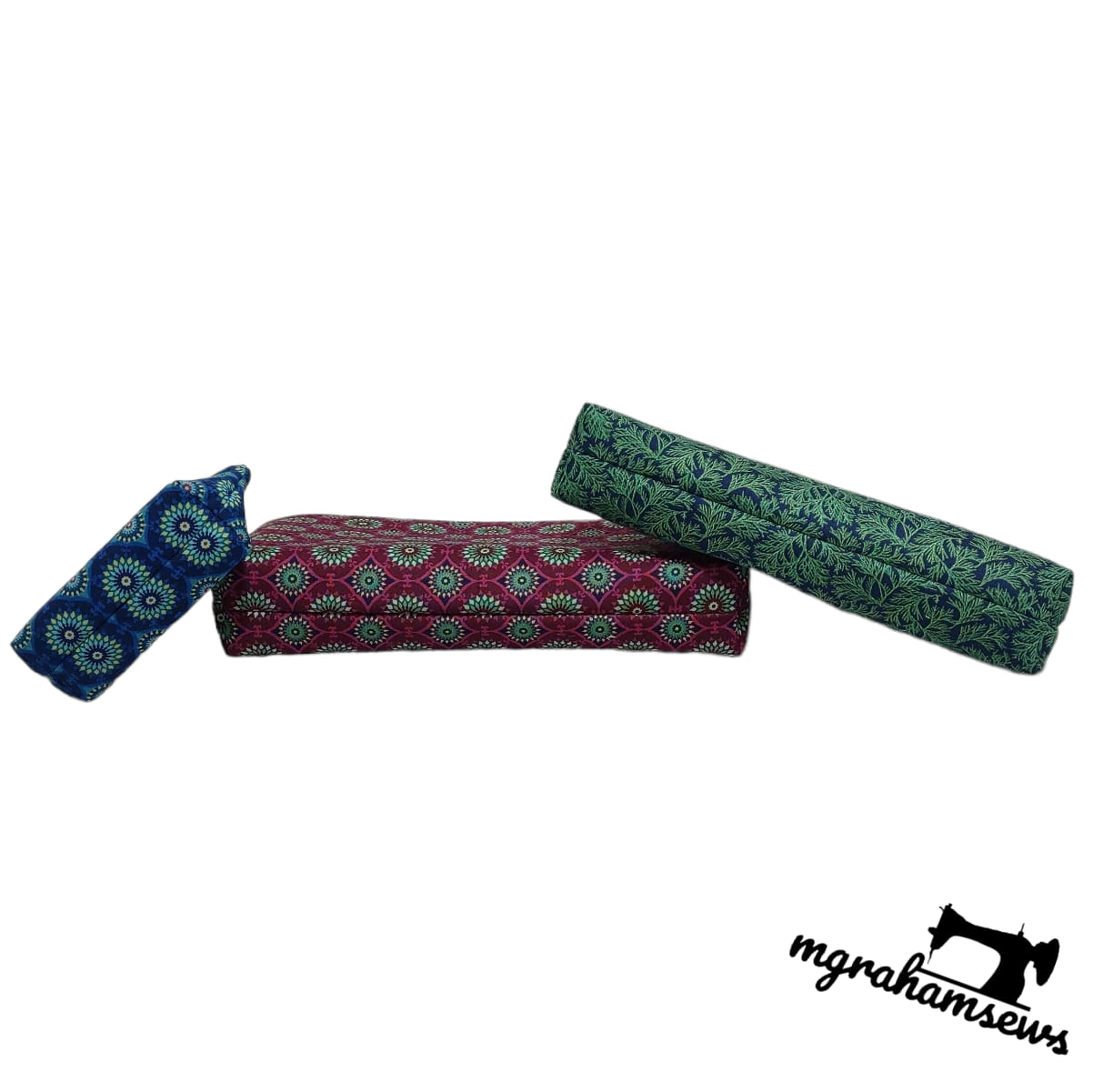 Three fabric rolls with patterns on a white background, featuring the 'mghamsews' brand logo.