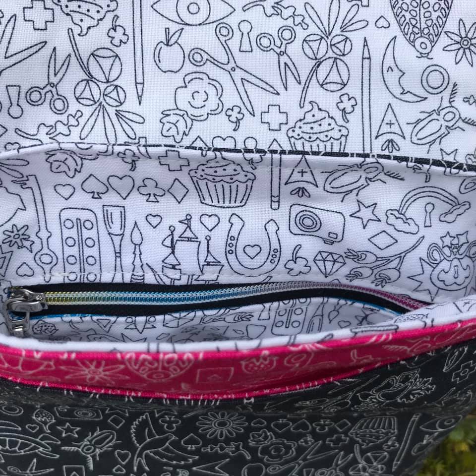 The Crossbody Bag PDF Sewing Pattern rear view with white and black fabric (pink detail)