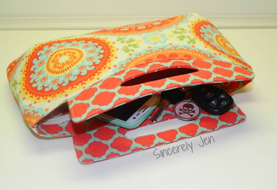  Coraline Clutch Sewing pattern  made by Sincerely Jen with items inside