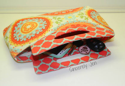  Coraline Clutch Sewing pattern  made by Sincerely Jen with items inside