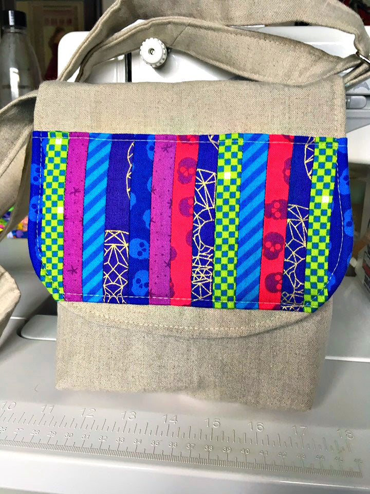 The Crossbody Bag PDF Sewing Pattern rear view with rainbow printed fabric  