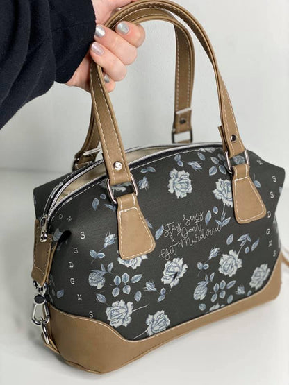 Brooklyn Handbag from Swoon Sewing Patterns, made by Lauren Mormino from More Me Know using grey rose patterned fabric and light brown coloured vinyl, with silver hardware