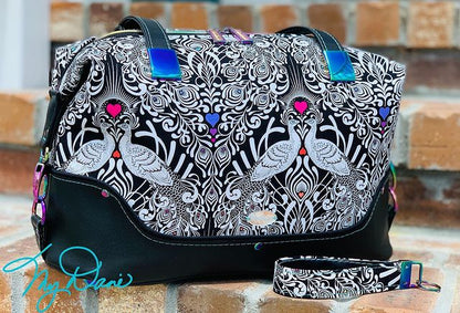 Brooklyn Bag from Swoon Sewing Patterns, made by Kimberly Cummins from MyDani Bags in Tula Pink fabric with black vinyl accents and rainbow coloured hardware